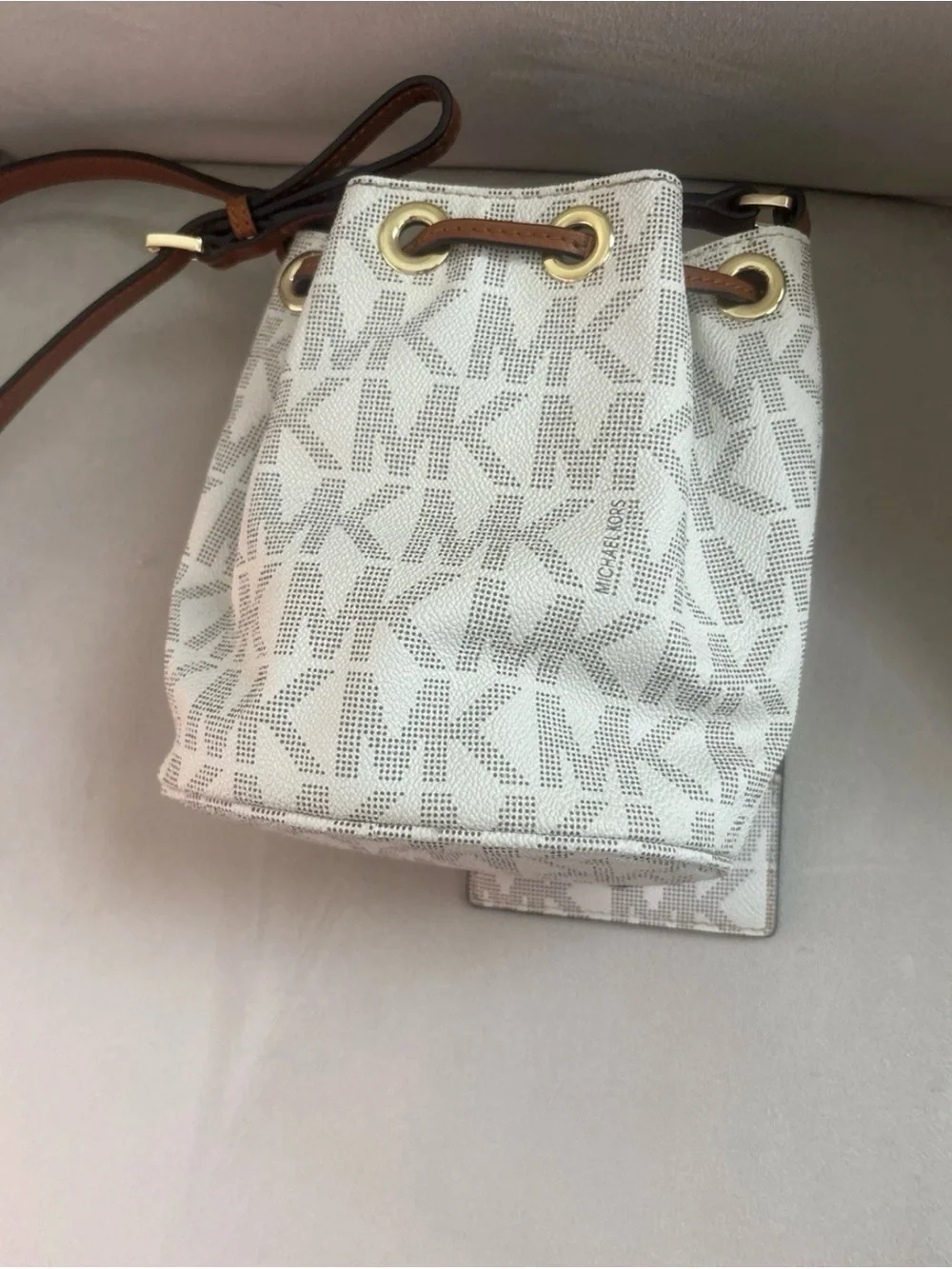 Michael Kors Cream Logo Drawstring Crossbody with Brown Trim and Gold Hardware